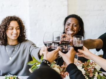 People enjoying wine dinner