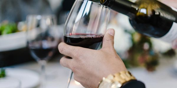 Red wine being poured into a glass