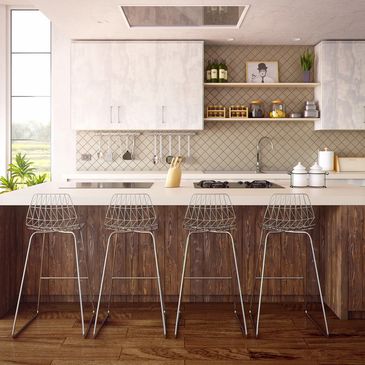 Modern kitchen with four stools and a tile backsplash.