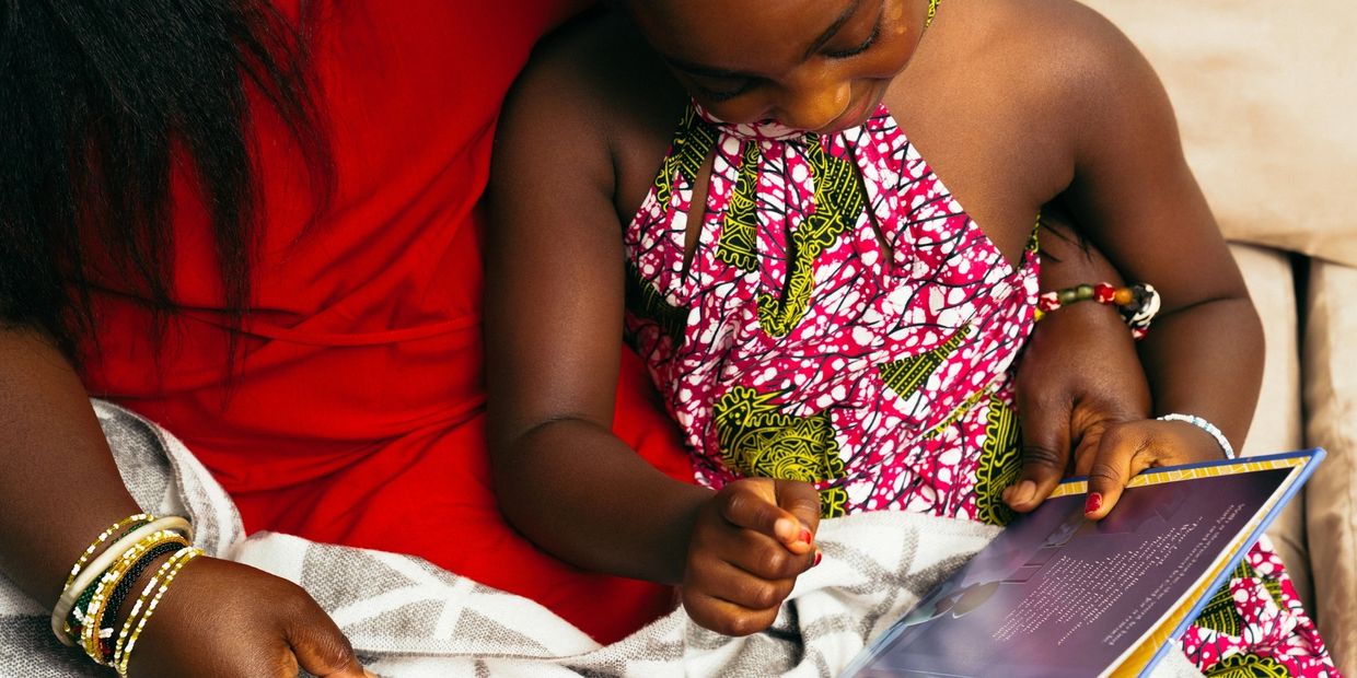 women reading to child