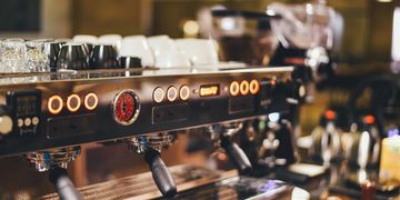 Close-up of a professional espresso machine in a café.