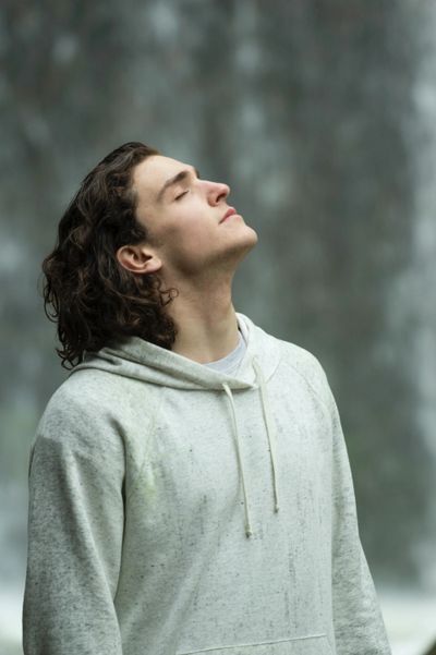 man with long curly hair