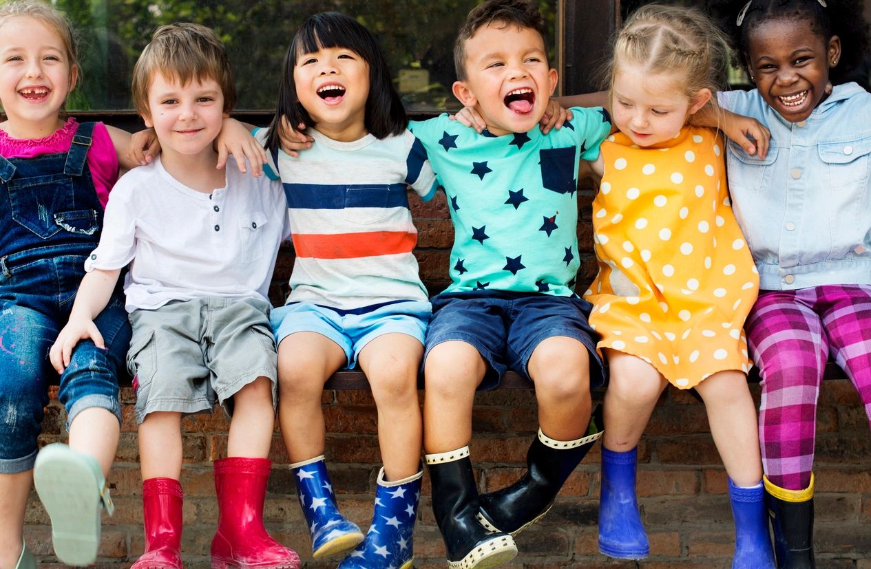 Children gathered together ready to enjoy creative off-screen play.