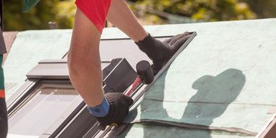 roof contractor installing a skylight