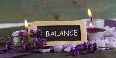 Lavender dried flowers with candles lit, balance message. Relaxed atmosphere. Magnetic Therapy!