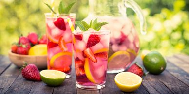 Refreshing strawberry lemon drink with ice and mint.