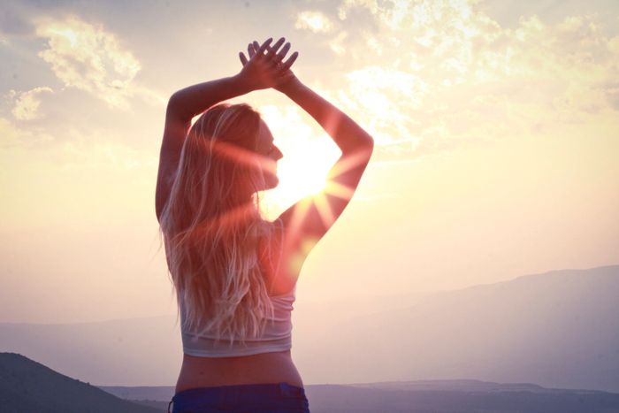 picture of a woman and a sunset