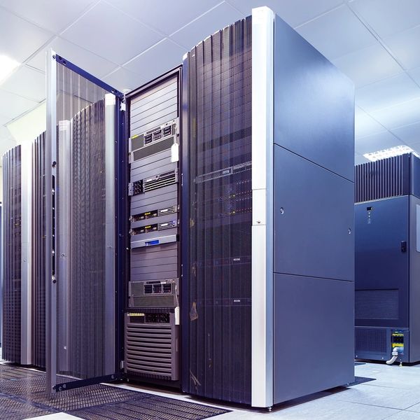 Modern data center with server racks and cooling systems.
