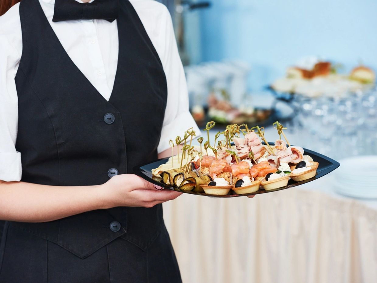 Server with platter of appetizers