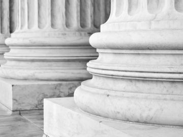 stone pillars outside a federal court building