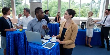 Two people speaking at a conference.