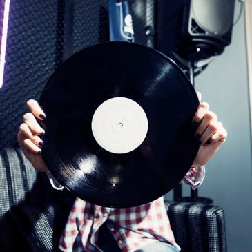Person holding a record.