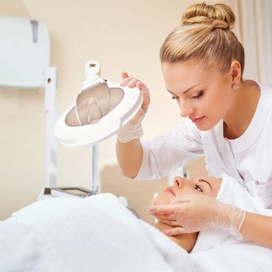 A Blond Woman Performing a Treatment Plan To A Woman