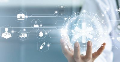 Hand holding a glowing medical network sphere with healthcare icons.