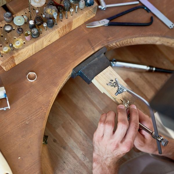 jeweler repairing at jewelers bench