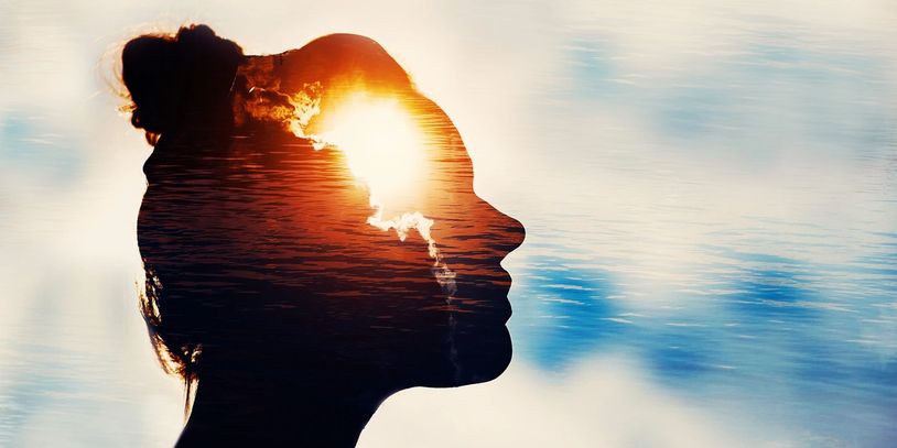Silhouette of a woman with sun and clouds over- Maternal mental health therapy for women in Florida.