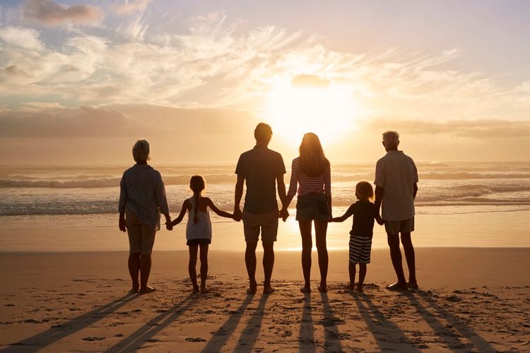 family sunset beach ocean waves