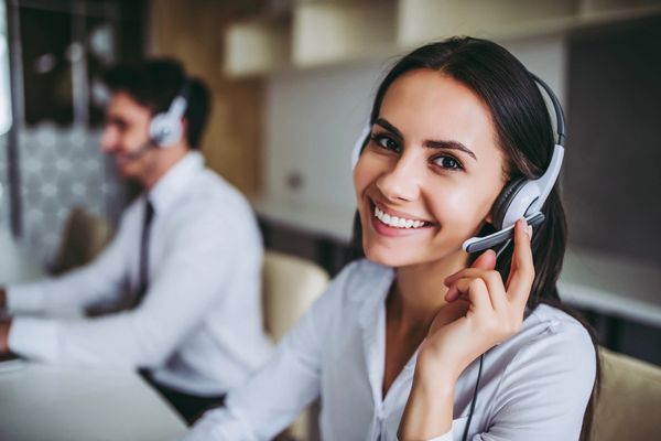 Smiling woman with a headset on