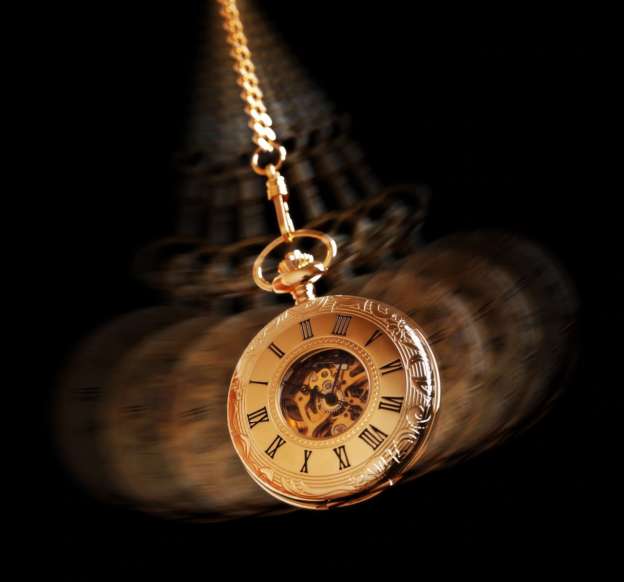A gold pocket watch, with roman numerals, is swinging against a black background.