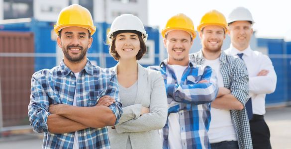 Five people wearing yellow helmets