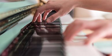 Adult playing piano 