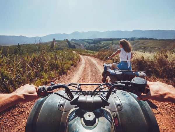 people riding an ATV