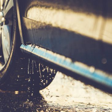 Clean car dripping with water