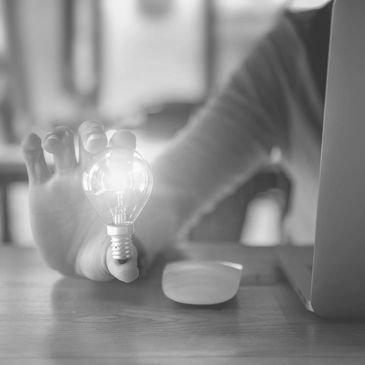 Big Sixty Vision and Planning logo of a woman holding a light bulb