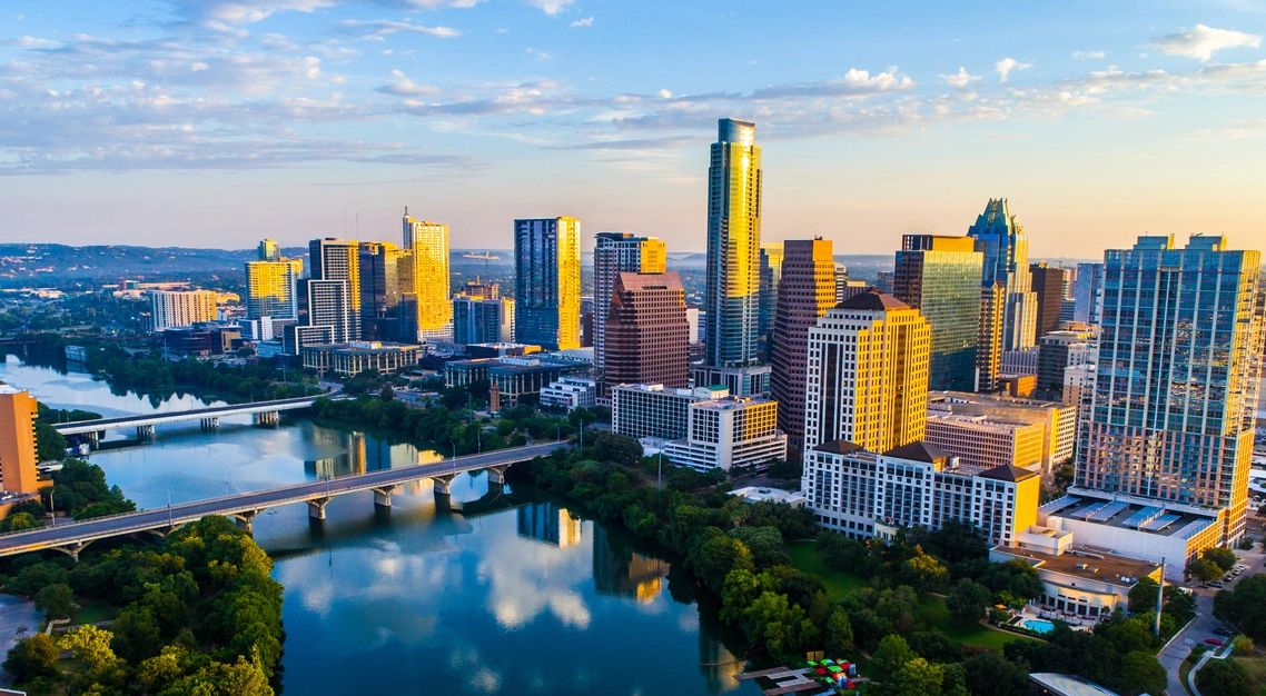 A drone shot of the Austin, Texas skyline during the day in springtime. 