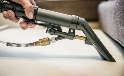 IICRC Technician Cleaning with a hand tool