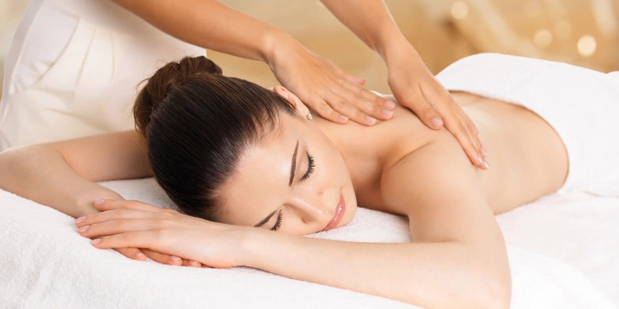 Woman getting back massage on the display