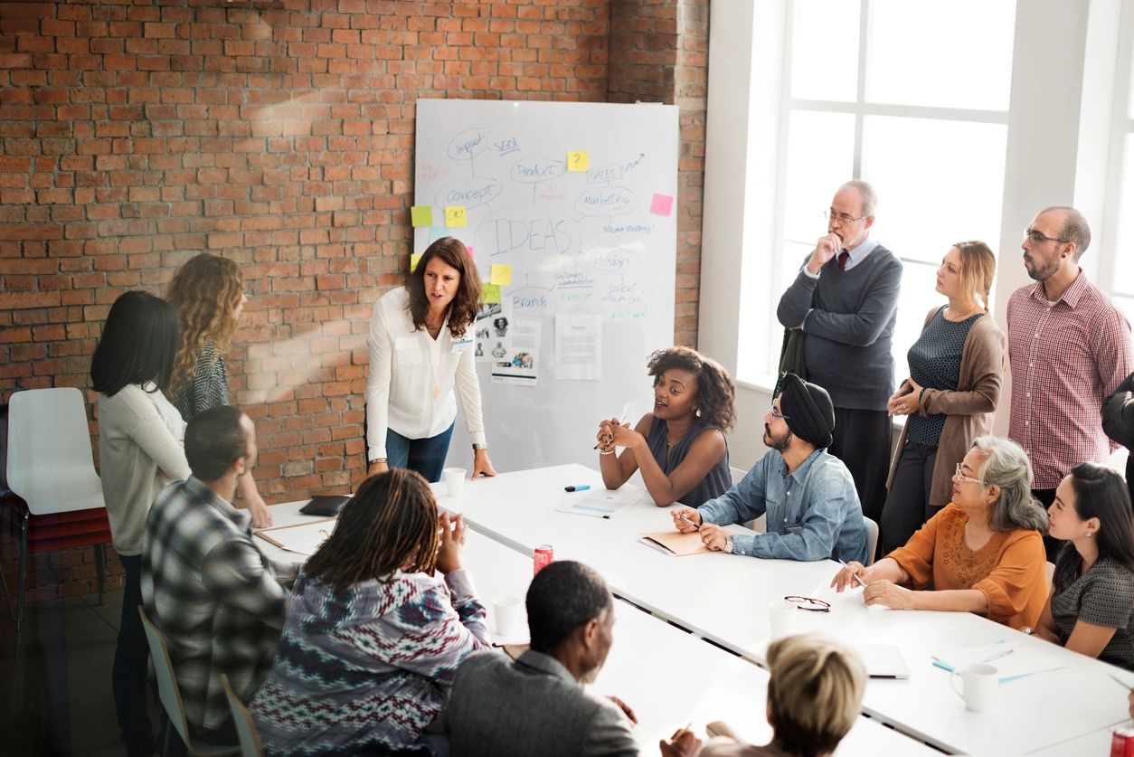 A group of people in a meeting