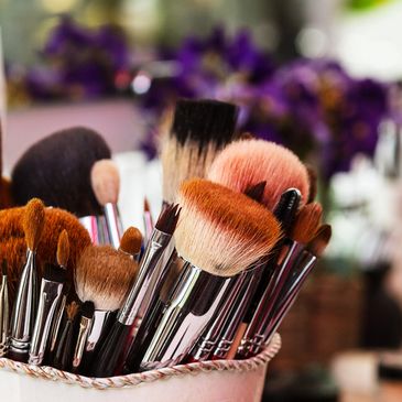 A set of different makeup brushes in a stand