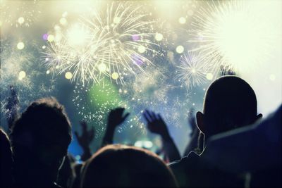 Group of people watching fireworks explode