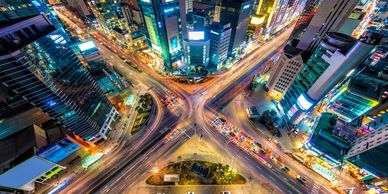 Generic city scene from above showing a busy junction at night .