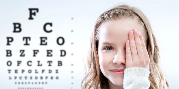 Girl looking at eye chart