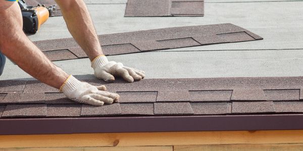 A person repairing the roof