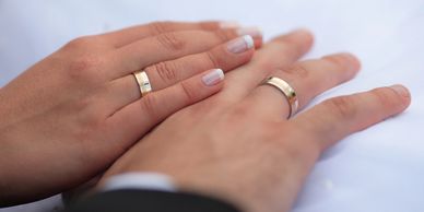 A picture of the newly weds and there rings 