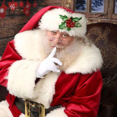 Santa Daryl smiling with children
